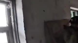 Bodycam footage shows Ukrainian soldiers under attack taking cover inside a house