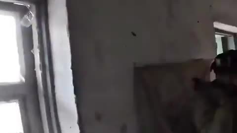 Bodycam footage shows Ukrainian soldiers under attack taking cover inside a house