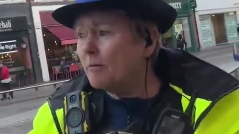 A man takes some photos of the landscape with his smartphone and is stopped and