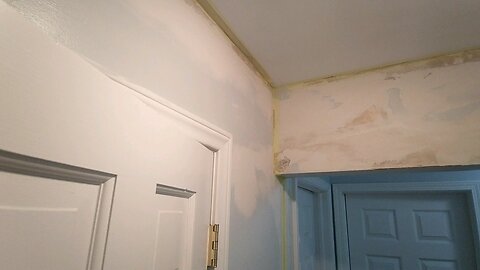 Mudding Water Damage Walls in Hall after one coat