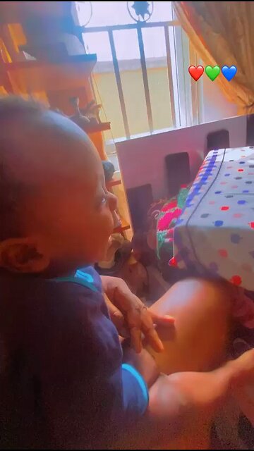 Watch this adorable baby playing with dad, check out his reaction. Too funny !