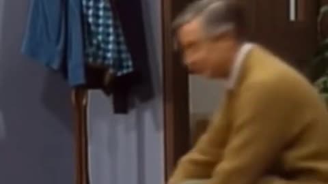 As Mr Rogers begins his episode, a 67 bus enters his living room