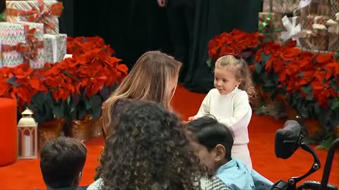The First Lady gets a hug from a little girl at the Children's National Hospital in Washington, D.C.