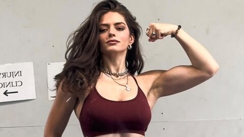 Beautiful muscle girl flexing