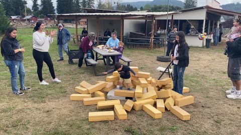 Family building box around boy