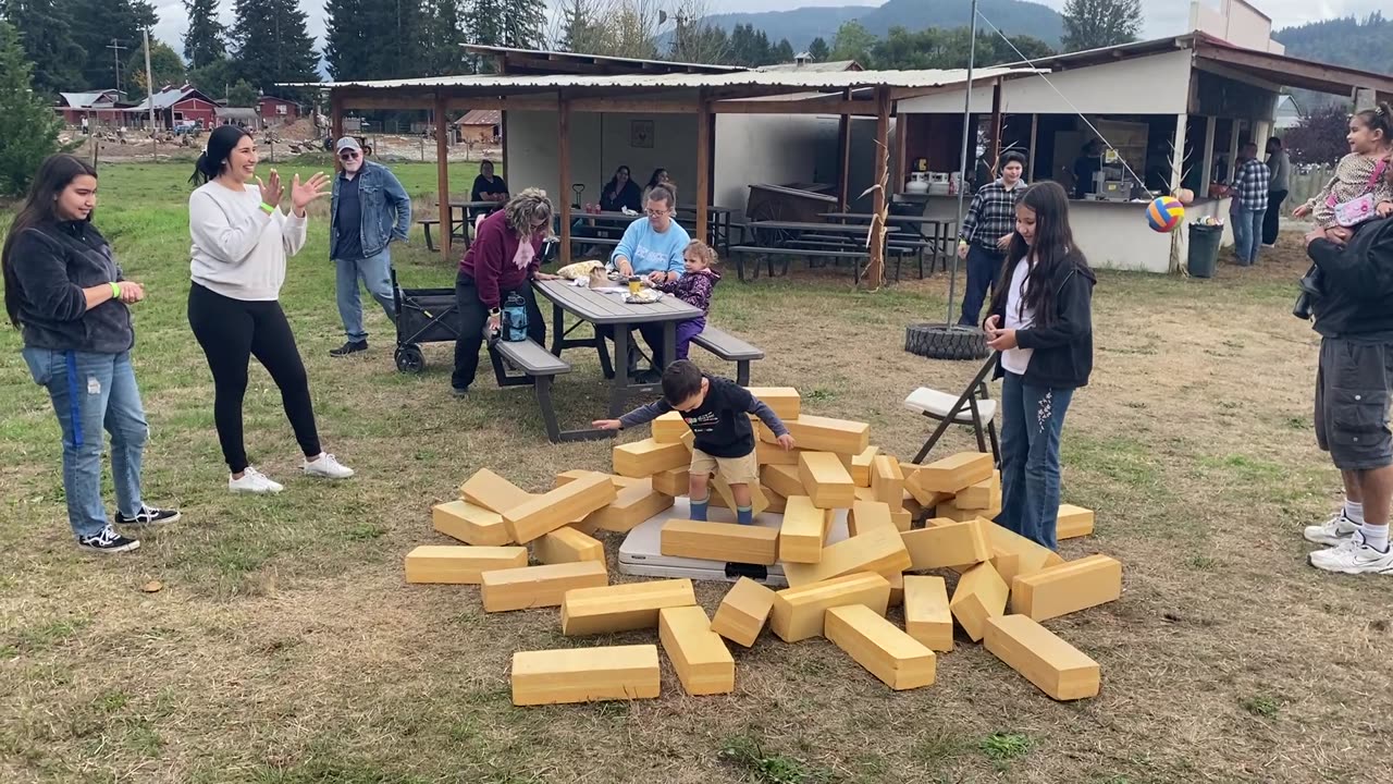 Family building box around boy