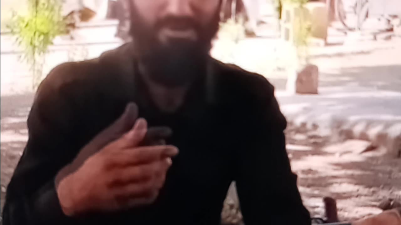 Taliban fighter practicing English