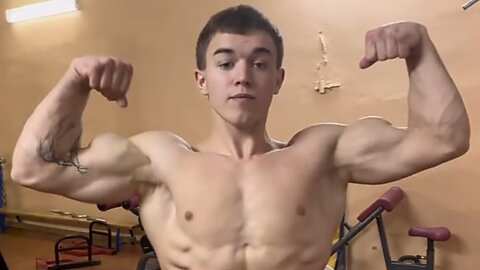 17 years old teen boy flexing muscles