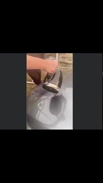 Life Hack: This man removes a huge dent from his car hood with a...a uh...well...a large tool 😳