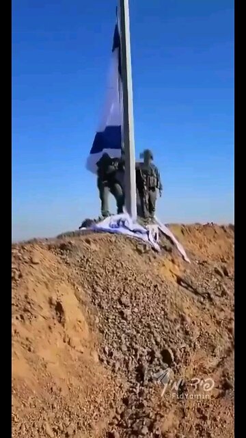 The Israeli flag is hoisted above the ruins of Gaza’s Shuja'iyya terror neighborhood.