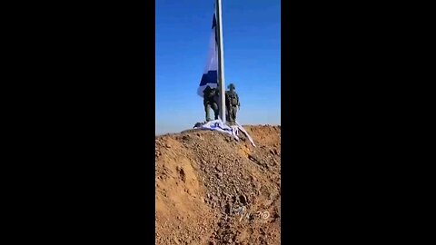 The Israeli flag is hoisted above the ruins of Gaza’s Shuja'iyya terror neighborhood.