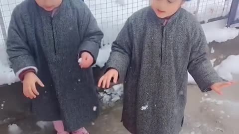 Both the girl child are enjoying in snowy season