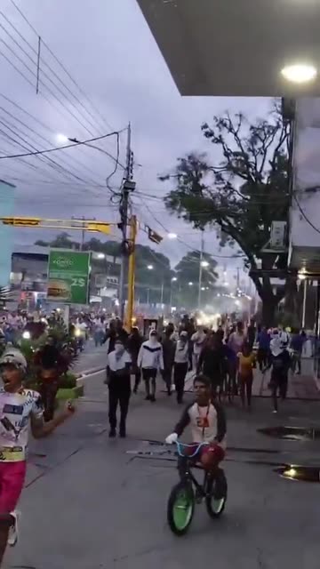 The statue of the dictator Hugo Chávez is dragged through the streets in Venezuela