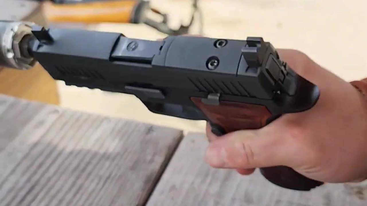 Sig Sauer Pistol with Carbon Fiber Suppressor!