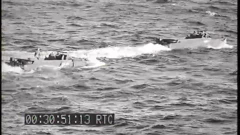 MARINE ASSAULT TROO... - MARINE ASSAULT TROOPS TRANSFER TO LSTs; CASUALTIES HOISTED A - 428-npc-1524