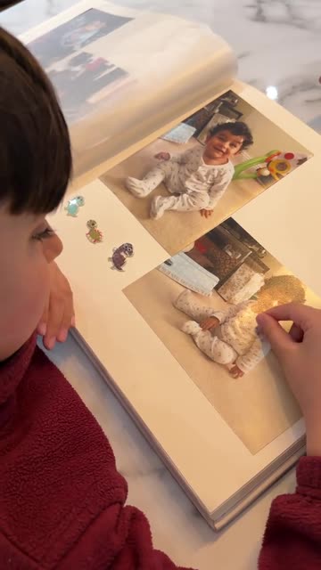 6-Year-Old Tries to Zoom in on Photo Album