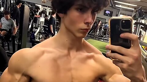 19 years old bodybuilder flexing muscles