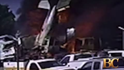 2 dead after plane crashes into 18-wheeler in fiery explosion