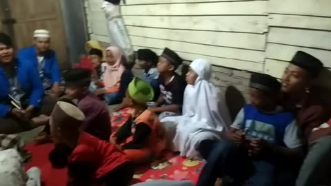 Qur'an Moments: KKN Students Reciting with Village Children