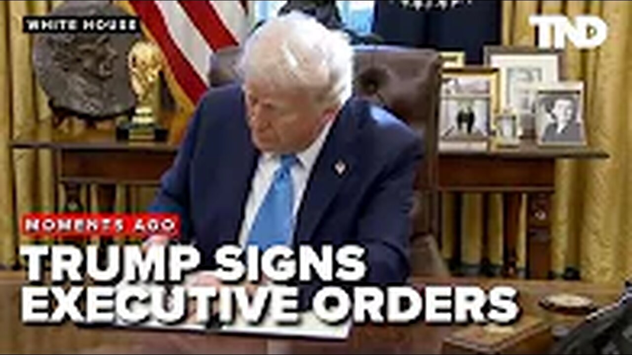 President Donald Trump signs executive orders with gaggle of reporters in Oval Office