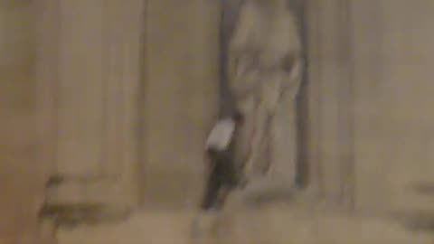 Man destroying sculpture by paedophile artist Eric Gill statue at BBC Broadcasting House 12 Jan 2022