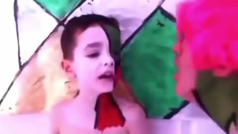 Stephen Colbert traumatizing a poor innocent child for adrenochrome
