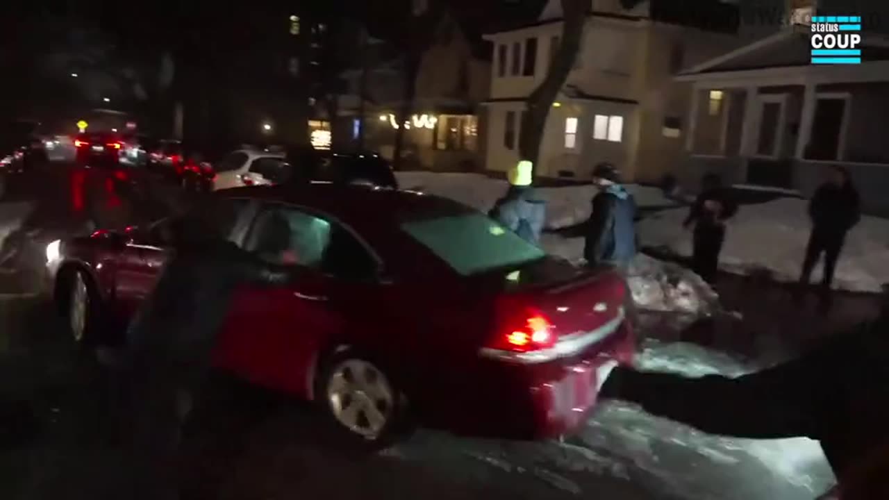 Car drives through Minneapolis protesters