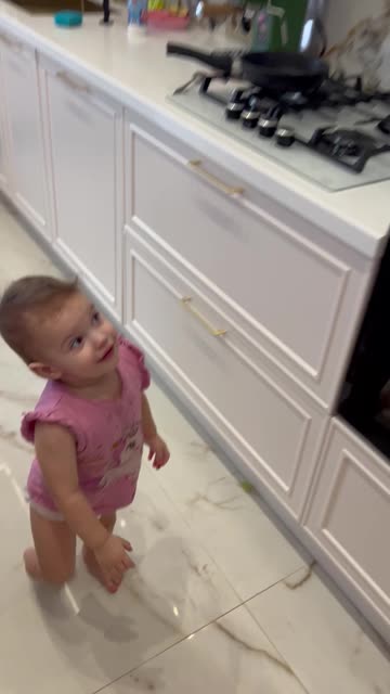 Little Girl Plays With a Snake