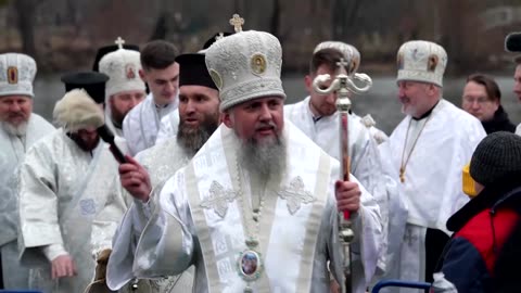 Ukrainians celebrate Epiphany with a plunge in the Dnipro river