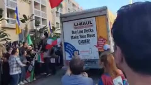 U-HAUL truck plows through a massive Iran, protest