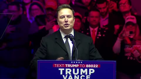 President Donald J. Trump introduces Elon Musk and his son X on stage.