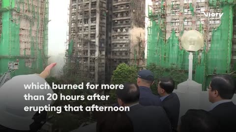 Hong Kong’s leader inspects charred high-rise after deadly blaze kills 94