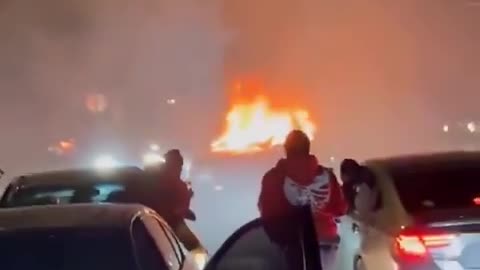 negro mixed mob do a street takeover,attack homeowner and burn security vehicle