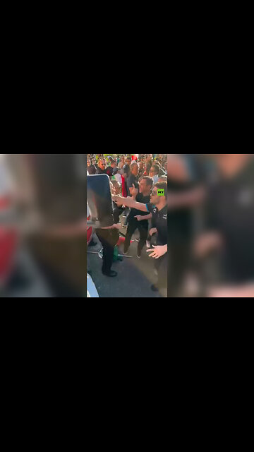 Anti-Khamenei Protesters pull a man from the truck and smash the windows in Los Angeles