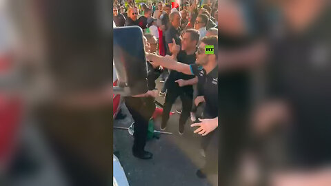 Anti-Khamenei Protesters pull a man from the truck and smash the windows in Los Angeles