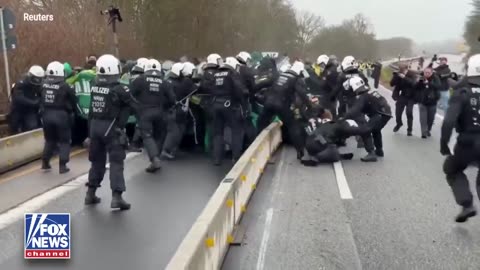 German police dispersed a crowd of 25,000–30,000 protesters, including Antifa activists,