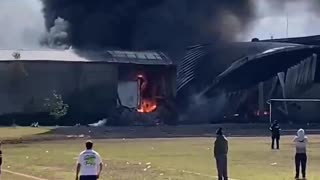 Small plane carrying 10 people crashes into building in Toluca