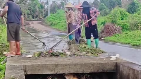 A satisfying cleaning of the debris from a water canal.hd