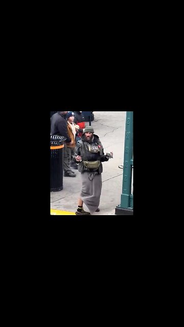 People stroll past Wild-looking Man Brandishing a Knife like it's normal - only in New York