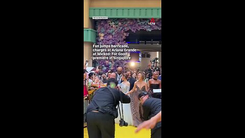 A fan jumped a barricade and rushed at Ariana Grande at the premiere of Wicked: For Good in Singapor