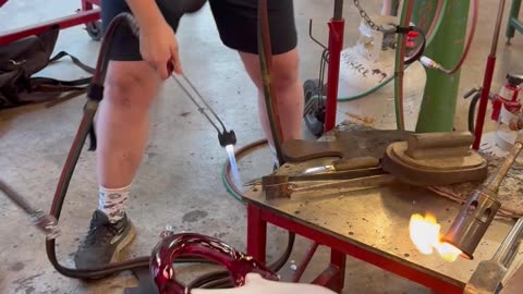 Artist Blows Glass Bag Holding Itself