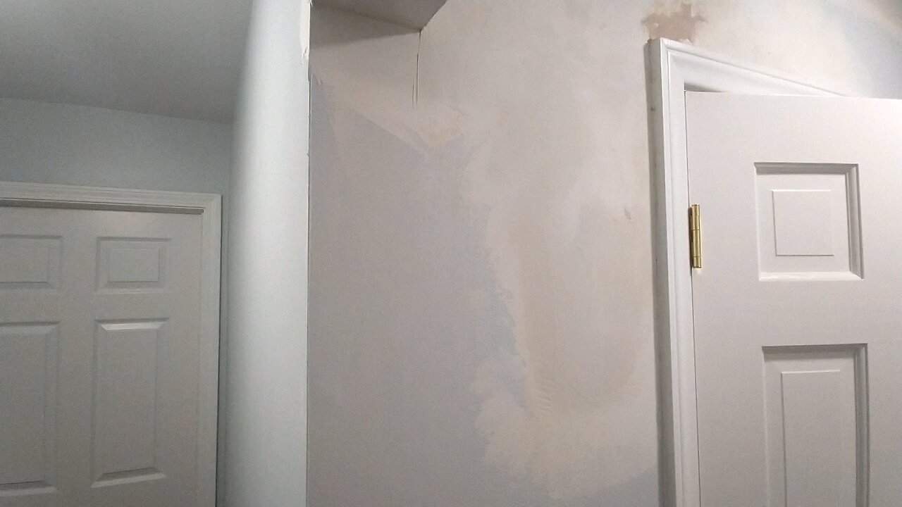 Mudding Water Damage Walls in Hall