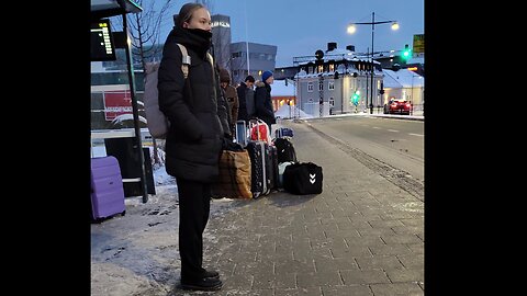 Girl freezing in the northern winter frost of real feel -16°C. Dancing to warm up. Red ears