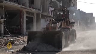 Bulldozers clear rubble in Gaza City as Palestinians return to rebuild homes and lives