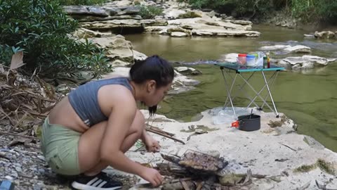 Camping in the forest by a stream, a joyful and exciting day of camping.