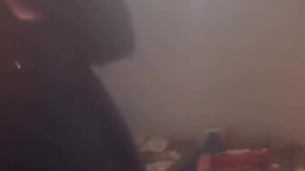 A Haitian woman explains to CPS that her home is not in poor conditions.