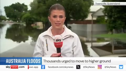 Woman dies in Australian floods as people flee homes