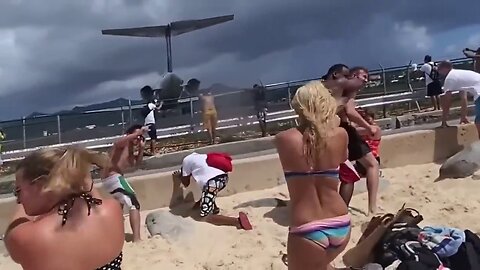 Tourists get blown away by an MD80 Series Aircraft takeoff at St. Martin Airport.