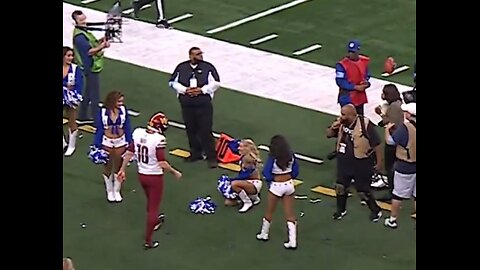 Dallas Cowboy Cheerleader Gets Nailed In The Head By Football