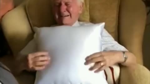 Care taker gives veteran a pillow with his late wife's image on it. His reaction is priceless.